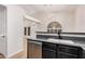 Bright kitchen features stainless steel dishwasher and black granite countertop with decorative window at 917 N Blackbird Dr, Gilbert, AZ 85234