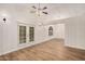 Bright living room featuring high ceilings, a ceiling fan, and access to outdoor space at 917 N Blackbird Dr, Gilbert, AZ 85234
