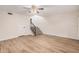 Open-concept living area featuring sleek floors and staircase at 917 N Blackbird Dr, Gilbert, AZ 85234