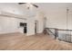 Open living space with stairs and black railing, ceiling fan, and natural light at 917 N Blackbird Dr, Gilbert, AZ 85234