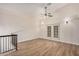 Upstairs Living Room with vaulted ceiling, ceiling fan and double french doors at 917 N Blackbird Dr, Gilbert, AZ 85234