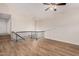 Living room with staircase and railing, vaulted ceiling, ceiling fan and chandelier at 917 N Blackbird Dr, Gilbert, AZ 85234