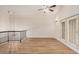 Loft-style living room with staircase, vaulted ceiling, chandelier and double doors at 917 N Blackbird Dr, Gilbert, AZ 85234