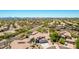 Gorgeous home with mountain views, a tile roof, and mature landscaping in a desert community at 9203 E Topeka Dr, Scottsdale, AZ 85255