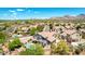 View of home with a well-manicured backyard, patio, and private pool in a desirable neighborhood at 9203 E Topeka Dr, Scottsdale, AZ 85255
