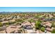 Stunning aerial view of a home with mountain views in a lush desert community at 9203 E Topeka Dr, Scottsdale, AZ 85255