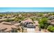 Overhead view showcases a well maintained home featuring lovely desert landscaping in a desert community at 9203 E Topeka Dr, Scottsdale, AZ 85255