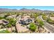 View of home with a large, well-manicured backyard, desert landscaping and private pool at 9203 E Topeka Dr, Scottsdale, AZ 85255