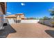 Expansive backyard with gravel ground cover and a block wall, offering ample space for outdoor activities at 9203 E Topeka Dr, Scottsdale, AZ 85255
