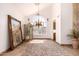 Dining room with high ceilings, chandelier, and abundant natural light at 9203 E Topeka Dr, Scottsdale, AZ 85255