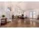 Open living room with high ceilings, staircase, and ample natural light at 9203 E Topeka Dr, Scottsdale, AZ 85255