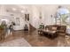 Spacious living room with staircase, high ceilings, and tile flooring at 9203 E Topeka Dr, Scottsdale, AZ 85255
