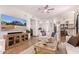 Bright living room with stylish decor, tiled flooring, and open access to the kitchen at 9203 E Topeka Dr, Scottsdale, AZ 85255
