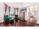 Cozy bedroom sitting area with hardwood floors, luxurious seating, and large windows overlooking scenic views at 9203 E Topeka Dr, Scottsdale, AZ 85255
