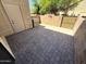 Backyard patio showcasing brick pavers, with a door and AC unit at 921 W University Dr # 1038, Mesa, AZ 85201