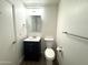 Modern half bathroom featuring a vanity with storage and a toilet at 921 W University Dr # 1038, Mesa, AZ 85201