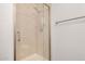 Shower stall features a glass door, silver hardware, and neutral tiling at 921 W University Dr # 1038, Mesa, AZ 85201