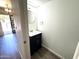 This half bathroom features modern fixtures, wood flooring, and a bright, clean aesthetic at 921 W University Dr # 1038, Mesa, AZ 85201
