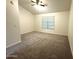 Large, carpeted bedroom featuring a ceiling fan and window with blinds at 921 W University Dr # 1038, Mesa, AZ 85201