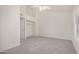 Bedroom with light gray carpeting, vaulted ceiling, ceiling fan, and closet at 921 W University Dr # 1038, Mesa, AZ 85201
