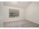 Bedroom with light gray carpeting, vaulted ceiling, and large window at 921 W University Dr # 1038, Mesa, AZ 85201