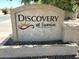 Close-up of Discovery at Sunrise sign with decorative stone base at 921 W University Dr # 1038, Mesa, AZ 85201