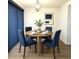 A well designed dining area with modern furniture, decor and wood flooring at 921 W University Dr # 1038, Mesa, AZ 85201