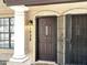 Inviting front door with security gate, decorative window, and exterior lighting at 921 W University Dr # 1038, Mesa, AZ 85201