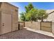 Private backyard patio with a brick surface, block fence, and convenient utility access at 921 W University Dr # 1038, Mesa, AZ 85201