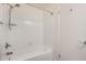Clean white tiled shower and bathtub combination with modern fixtures and door at 921 W University Dr # 1038, Mesa, AZ 85201