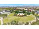 Aerial view of a well kept community green space with landscaping, walkways, a pond and a garden area at 9750 E Radioactive Dr, Mesa, AZ 85212