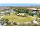 Aerial view of a well kept community green space with landscaping, walkways, a pond and a garden area at 9750 E Radioactive Dr, Mesa, AZ 85212