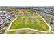 Aerial view of a community green space with sidewalks and landscaping in a Gathering friendly neighborhood at 9750 E Radioactive Dr, Mesa, AZ 85212