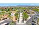 Aerial view of a community center featuring a lawn, landscaping, and recreational space for Gathering enjoyment at 9750 E Radioactive Dr, Mesa, AZ 85212