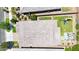 Aerial view of a home's roof, backyard with green lawn, and surrounding landscaping at 9750 E Radioactive Dr, Mesa, AZ 85212
