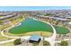 A beautiful view of a well kept community pond with walkways, landscaping, and a picnic area at 9750 E Radioactive Dr, Mesa, AZ 85212