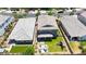 Aerial view of a house showcasing the backyard, play structure, patio, and lush landscaping at 9750 E Radioactive Dr, Mesa, AZ 85212