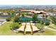 Aerial view of a well kept community green space with landscaping, walkways, a pond and a garden area at 9750 E Radioactive Dr, Mesa, AZ 85212