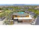 Aerial view of a community center featuring a swimming pool, landscaping, and recreational space for Gathering enjoyment at 9750 E Radioactive Dr, Mesa, AZ 85212