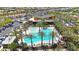 Aerial view of a community center featuring a swimming pool, landscaping, and recreational space for Gathering enjoyment at 9750 E Radioactive Dr, Mesa, AZ 85212