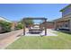 Beautiful backyard featuring a pergola covered dining area, perfect for outdoor entertaining at 9750 E Radioactive Dr, Mesa, AZ 85212