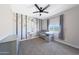 Adorable Bedroom with a forest-themed mural, gray crib, and ample natural light at 9750 E Radioactive Dr, Mesa, AZ 85212