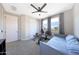 Bright bedroom with a daybed, exercise equipment, and windows providing pleasant outdoor views at 9750 E Radioactive Dr, Mesa, AZ 85212