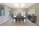 Elegant dining room featuring a spacious table, stylish light fixture, and abundant natural light at 9750 E Radioactive Dr, Mesa, AZ 85212