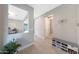 Bright foyer boasts neutral walls, sleek light-wood floors, and convenient shoe storage near the entrance at 9750 E Radioactive Dr, Mesa, AZ 85212