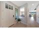 Bright foyer welcomes with natural light and a view into the dining and kitchen areas at 9750 E Radioactive Dr, Mesa, AZ 85212