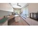 Bright home office featuring custom cabinets, modern ceiling fan, and plenty of workspace at 9750 E Radioactive Dr, Mesa, AZ 85212