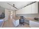 Spacious home office with custom built-ins, providing ample storage and workspace for productivity at 9750 E Radioactive Dr, Mesa, AZ 85212
