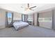 This spacious main bedroom boasts plenty of natural light and an ensuite bathroom and walk-in closet at 9750 E Radioactive Dr, Mesa, AZ 85212