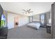 Bright and spacious main bedroom with an ensuite bathroom and walk-in closet offer luxury and comfort at 9750 E Radioactive Dr, Mesa, AZ 85212